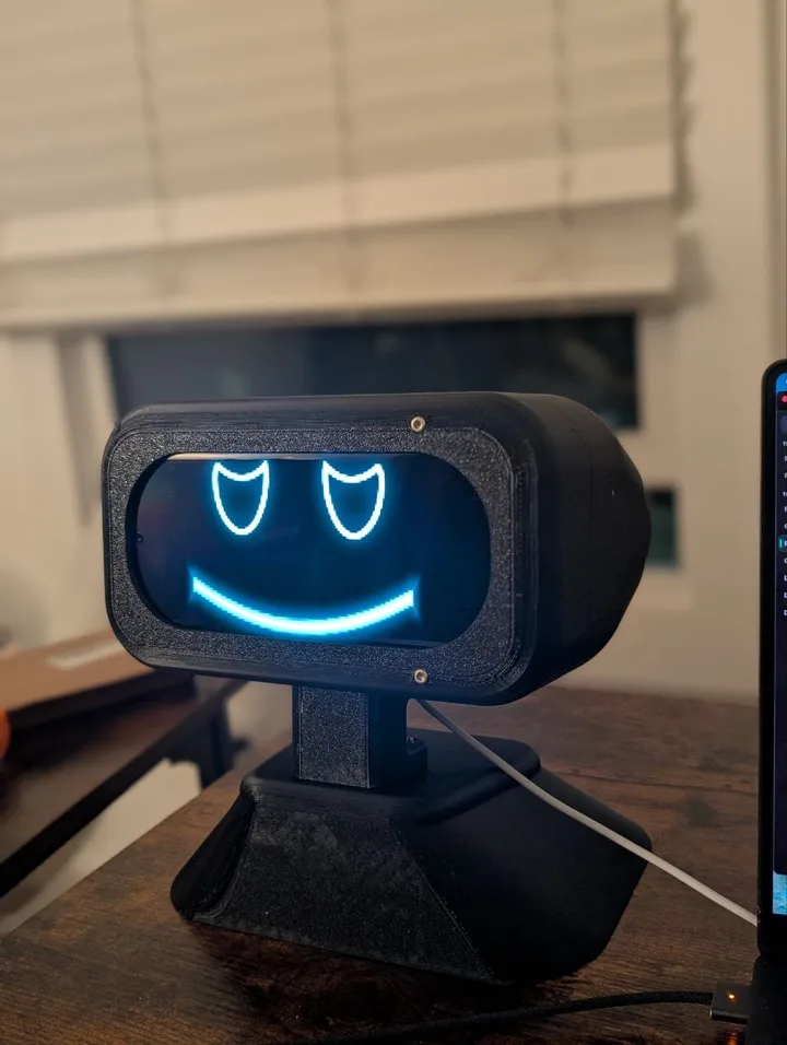 cyan-faced display on a desk
